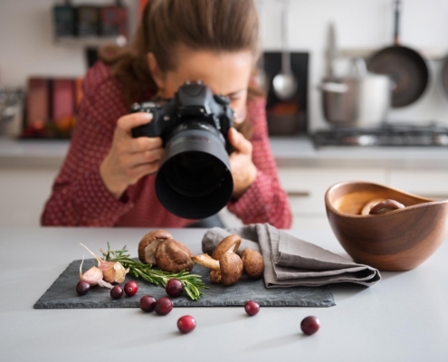 Image of a person taking photographs of produce.